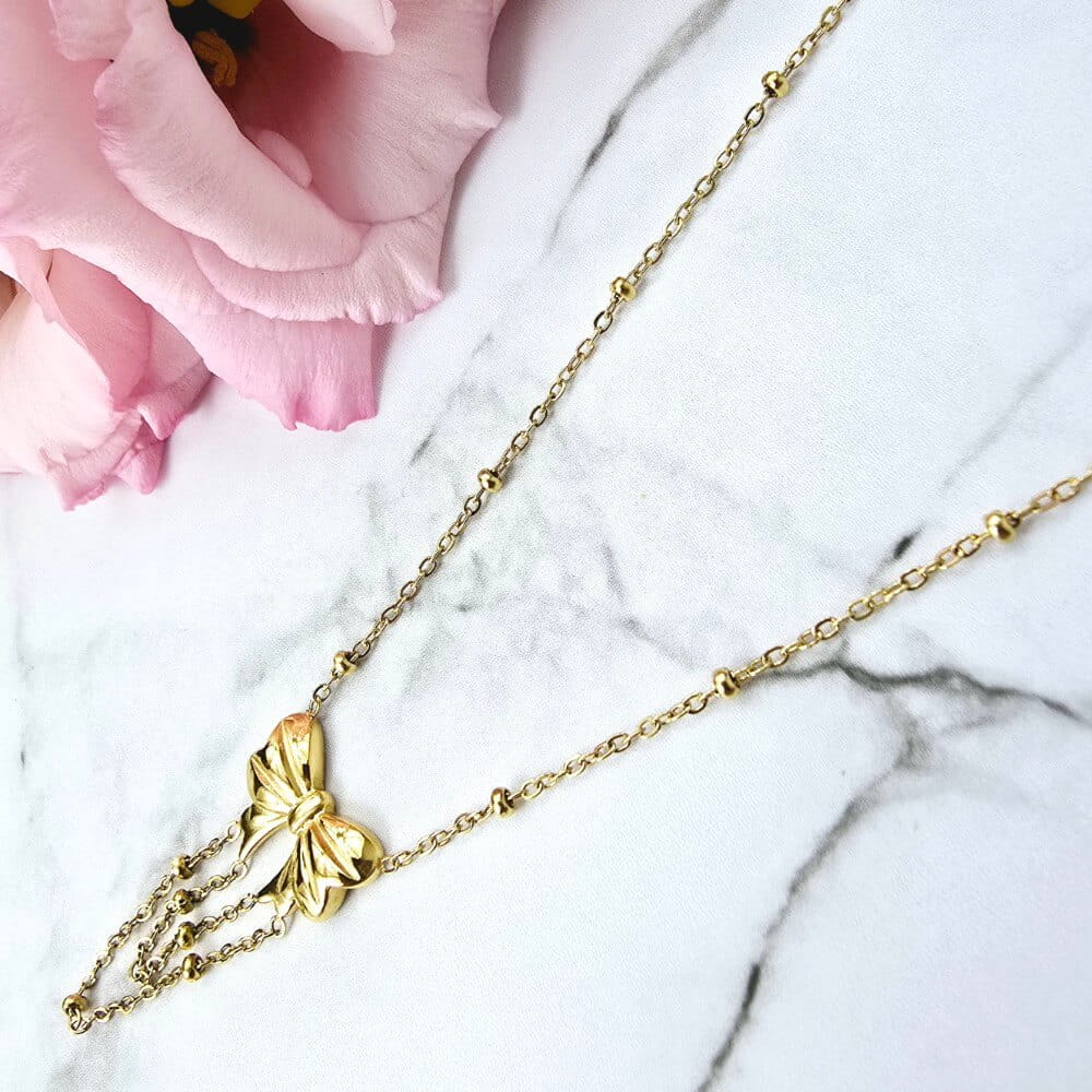 Naszyjnik STAL CHIRURGICZNA kulki złote kokardka łańcuszki